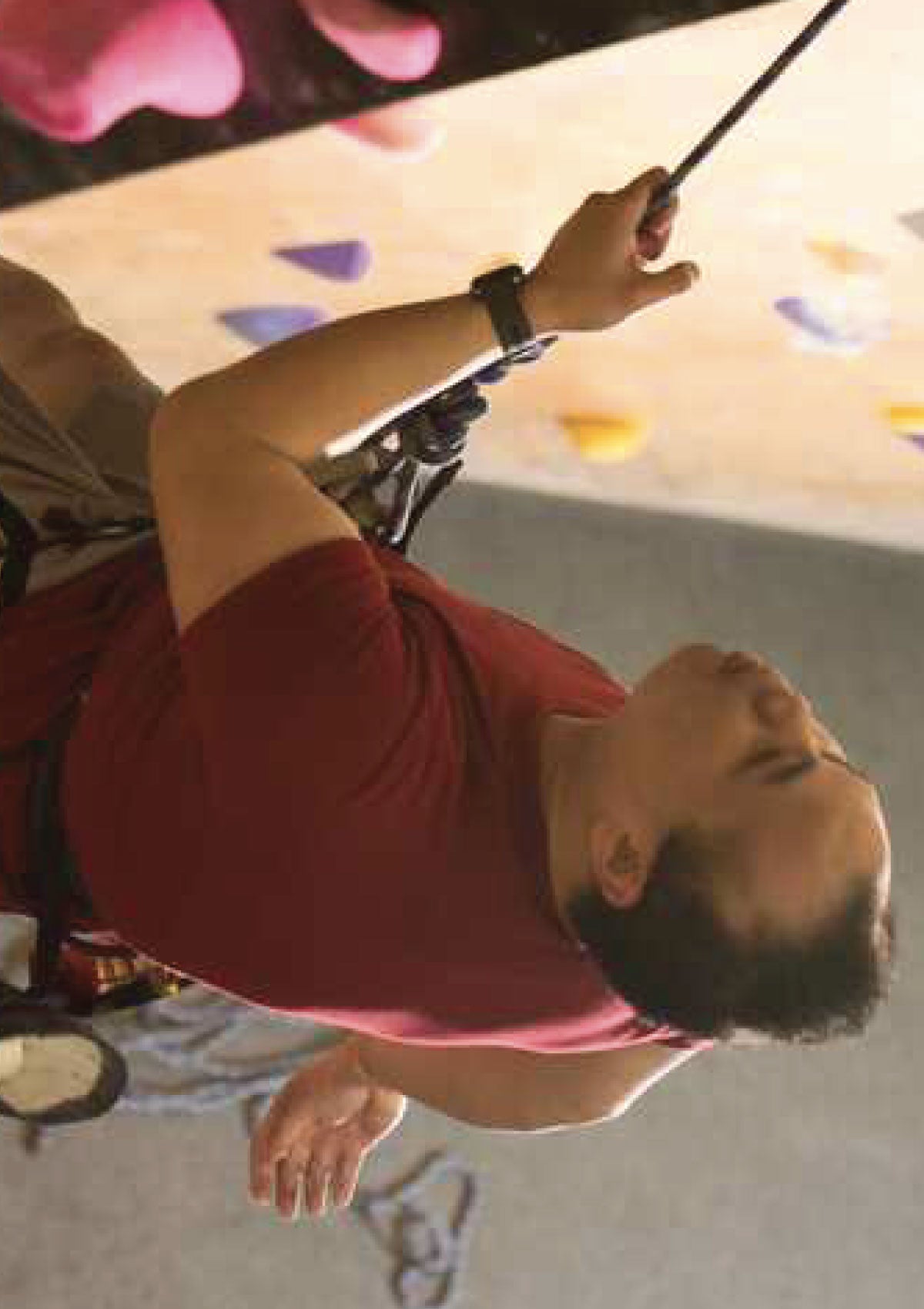 Man indoor rock climbing at Brooklyn Boulders